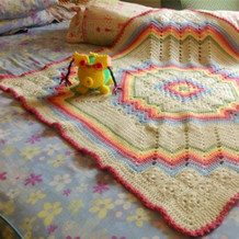 漂亮彩虹色钩针祖母方格毯子